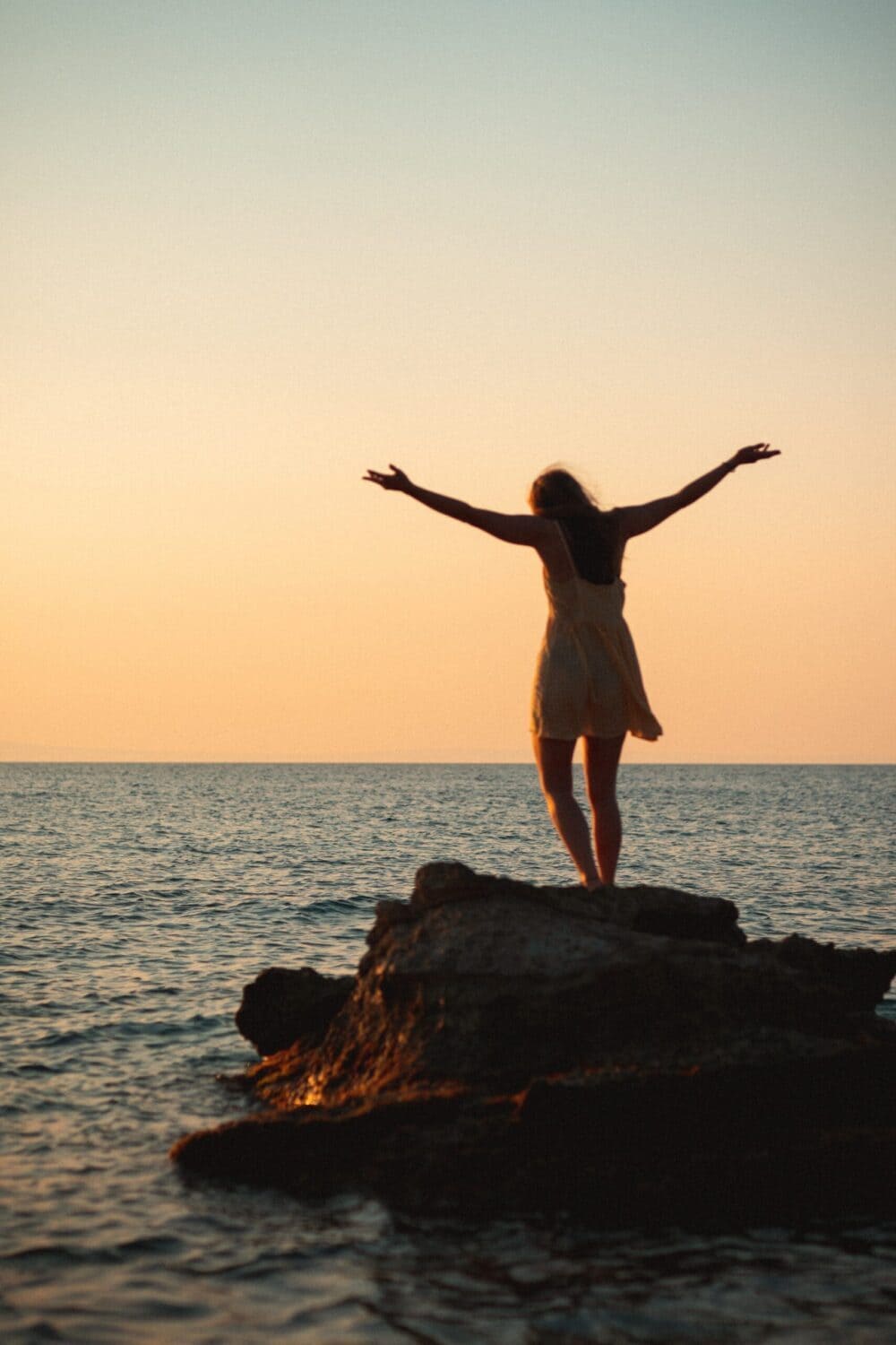 Euphoric Woman Embracing Sunset At The Beach