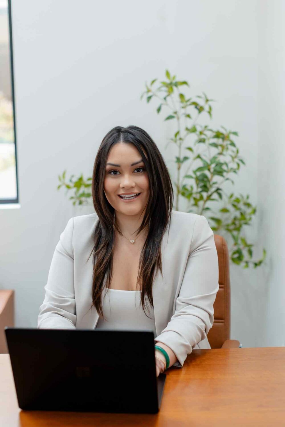 Professional Woman Working On Laptop At Best Life Counseling Services